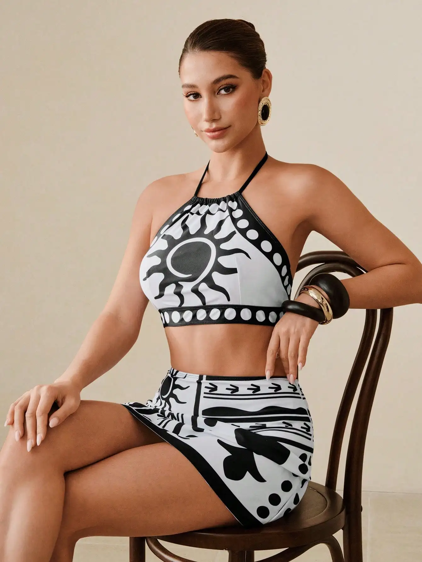 

Black And White Sun Motif Halter Top With Matching Mini Skirt Two Piece Swim Set For Beach Getaway