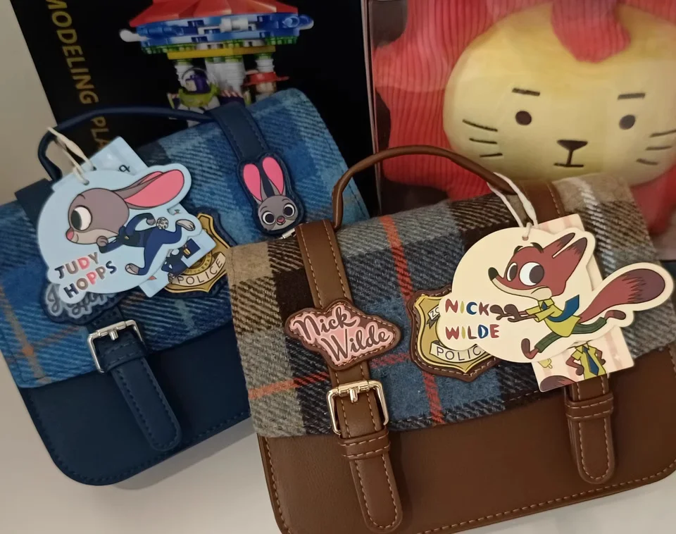 حقيبة يد Miniso Disney Zootopia Series حقيبة يد Nick Judy Cambridge حقيبة يد محمولة على الجسم حقيبة كروس لطيفة على الطراز البريطاني هدايا