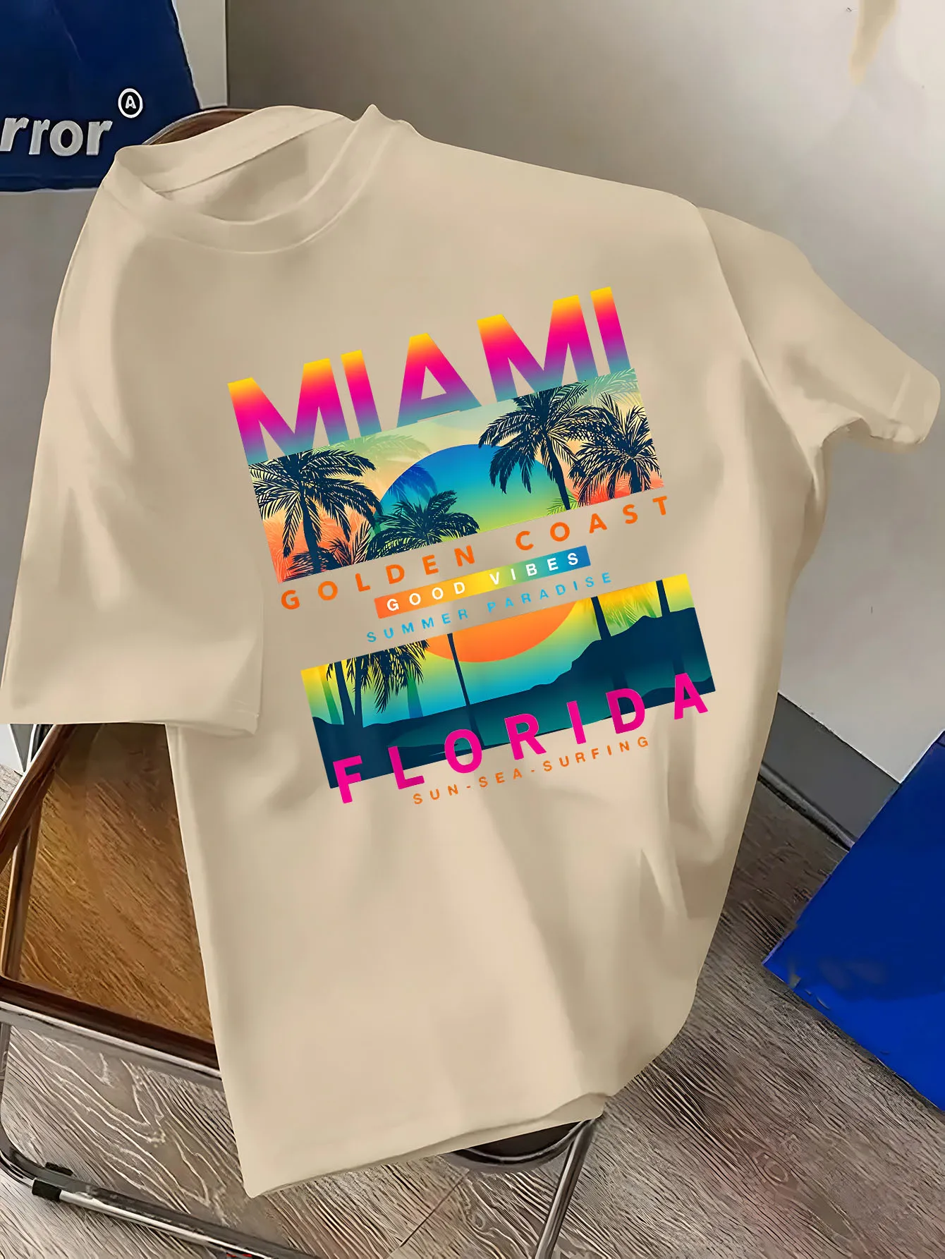 Men's short-sleeved t-shirt with Miami print pattern, featuring Florida palm trees and sunset, representing a summer paradise