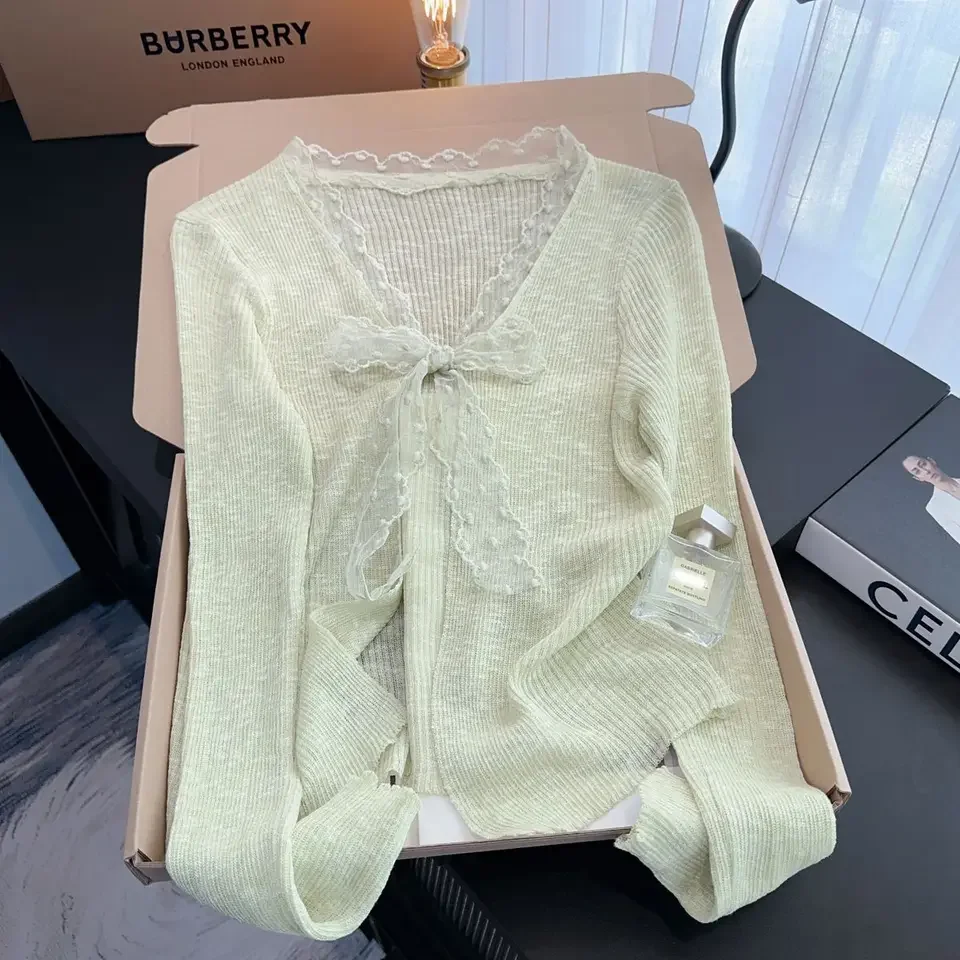 Cárdigan de punto con protección solar de encaje y lazo para mujer, novedad de verano, Top holgado con cuello en V, versión coreana, abrigo versátil de manga larga de Color sólido