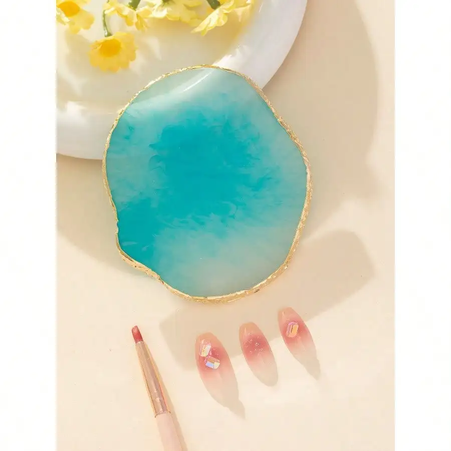 

Imitation Agate Resin Nail Color Palette with Gold Trim, portable round design. Ideal for nail art and press-on nails.