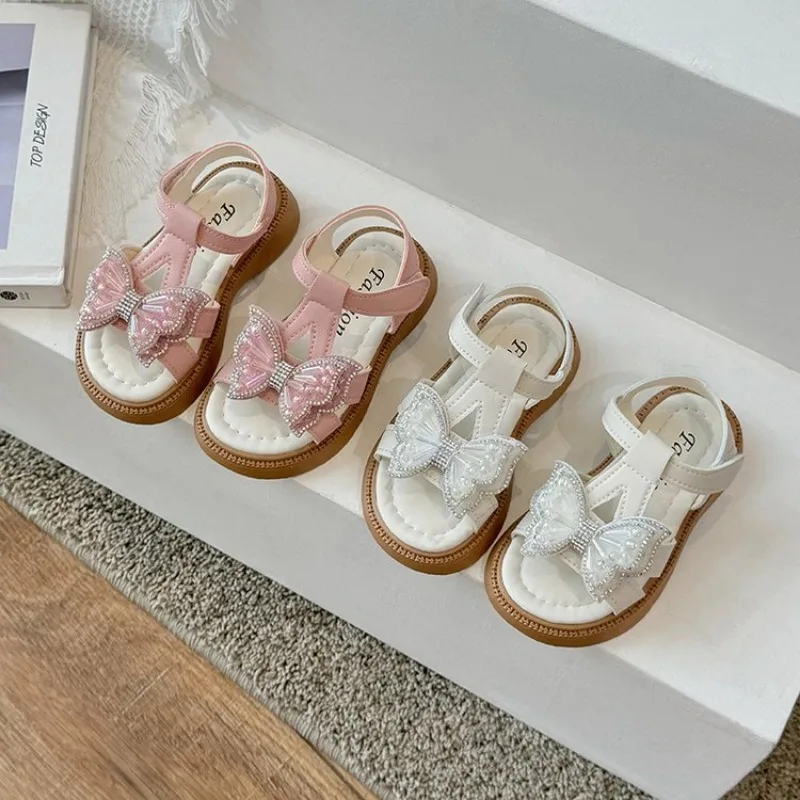 2024 nuovi sandali per bambini e ragazze con suola morbida fata con fiocco estivo, perla alla moda, scarpe da principessa per bambina K05