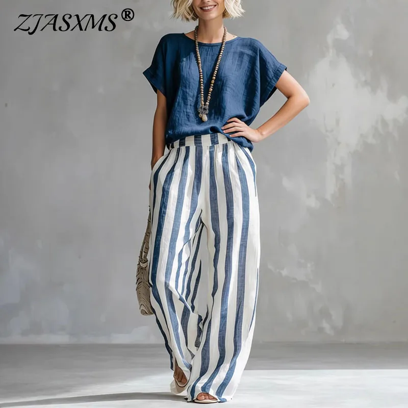 

Льняной комплект-двойка в стиле бохо 2026: женский повседневный костюм с укороченным однотонным топом и полосатыми брюками с высокой талией и широкими штанинами для летнего отпуска