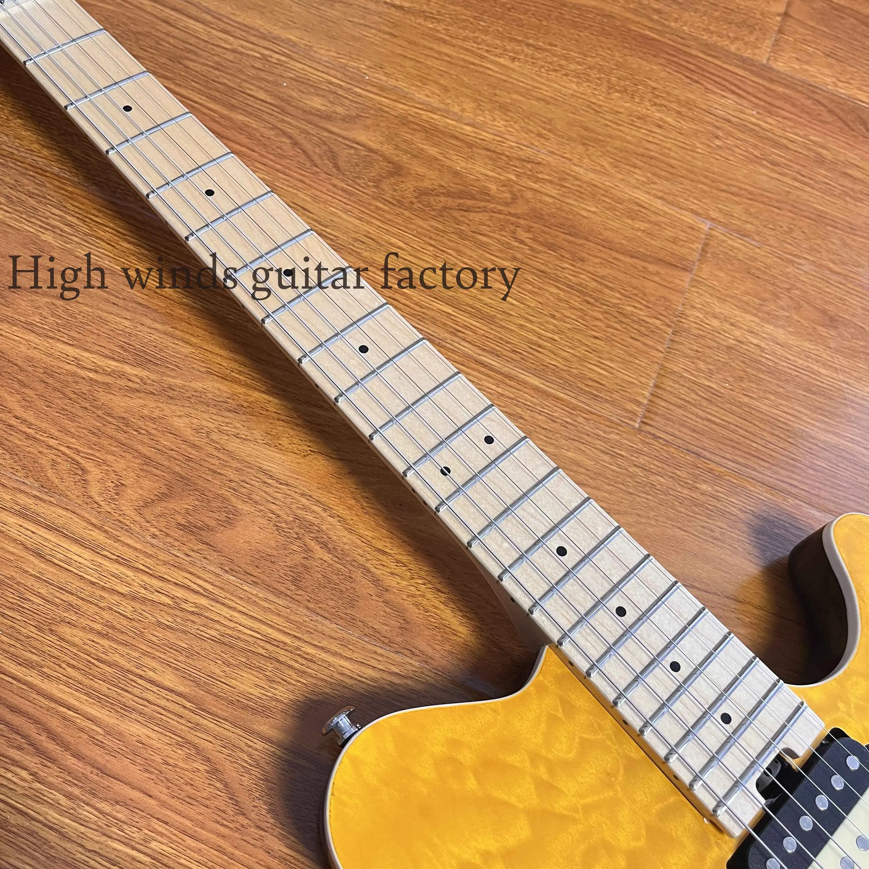 The electric guitar has a two-color pickup with a maple mahogany body and a maple neck