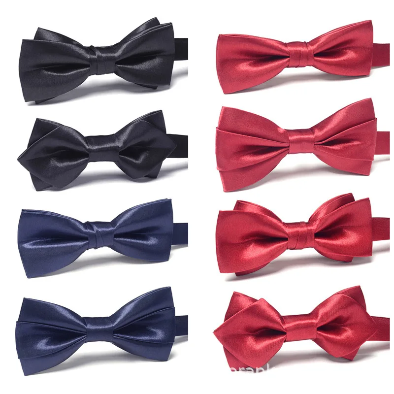 

The groom performed high-end blue-black bow with glossy finish in formal wedding shirt with red bow tie