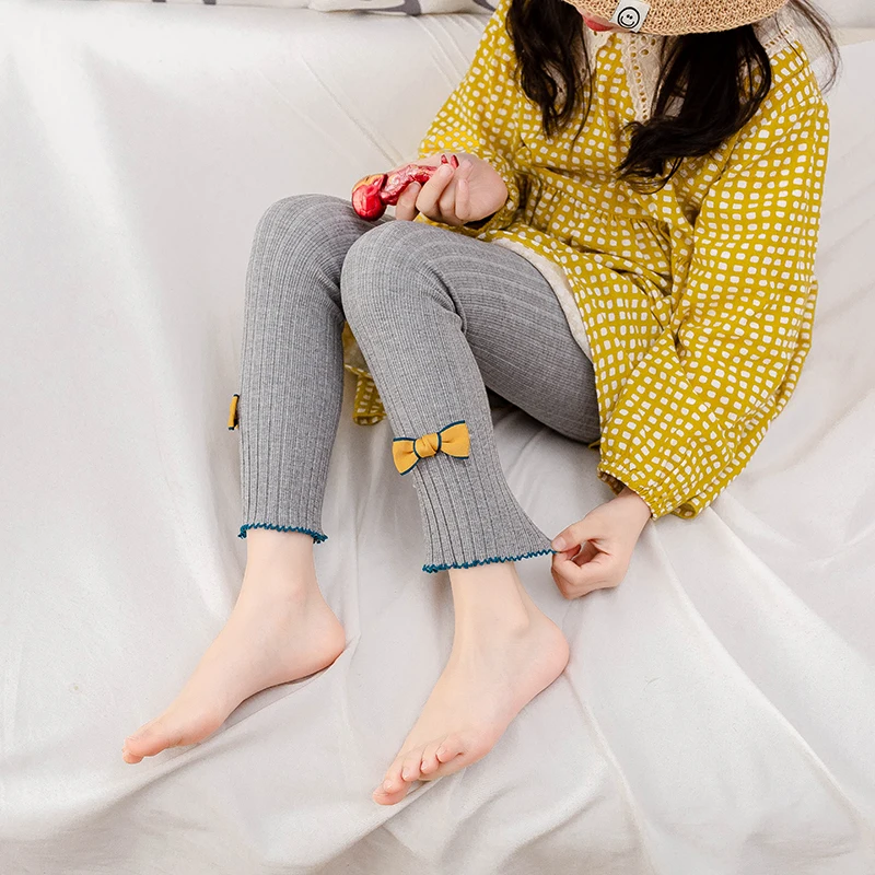 Girls Solid Color Nine-Point Leggings With Bow Vertical Stripes And Hem Wrapped Edges Elastic Skin-Friendly Knit Fabric Bottoms