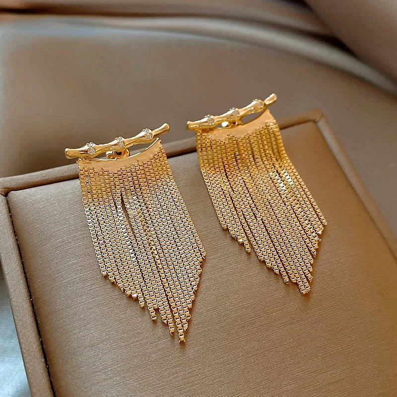 

Golden bamboo long tassel earrings light luxury high-end studs 2024 new unique temperament New Year's earrings women