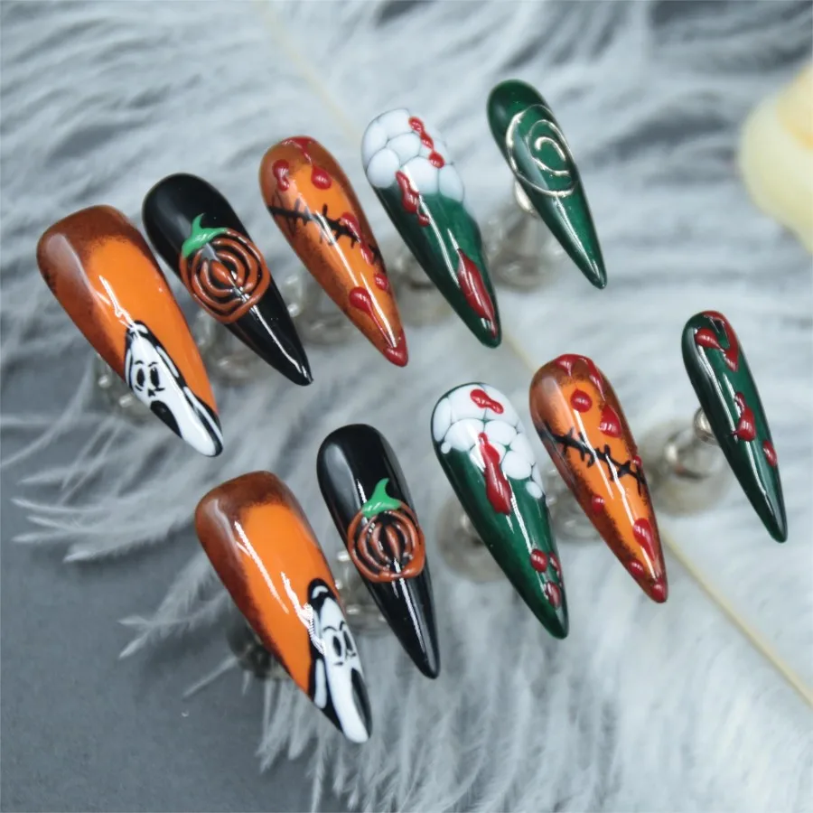 Handmade pressed fake nails, pumpkin Halloween elements, adhesive fake nails, long pointed styles, finished nail art,