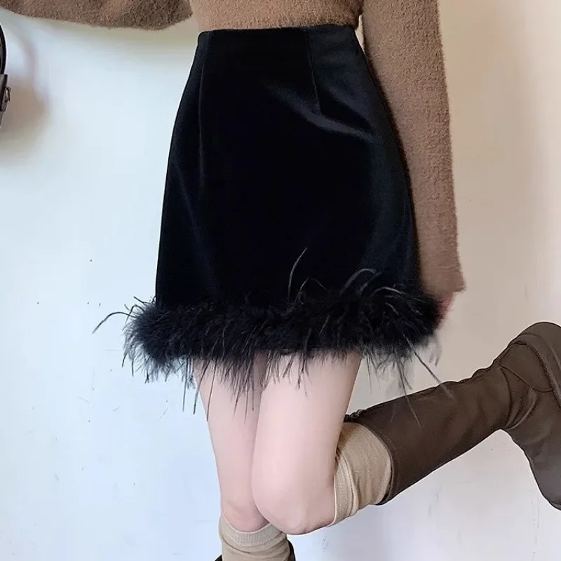 

Korean design velvet skirt women's autumn and winter new high waist fashion temperament small fragrance velvet tassel hip skirt