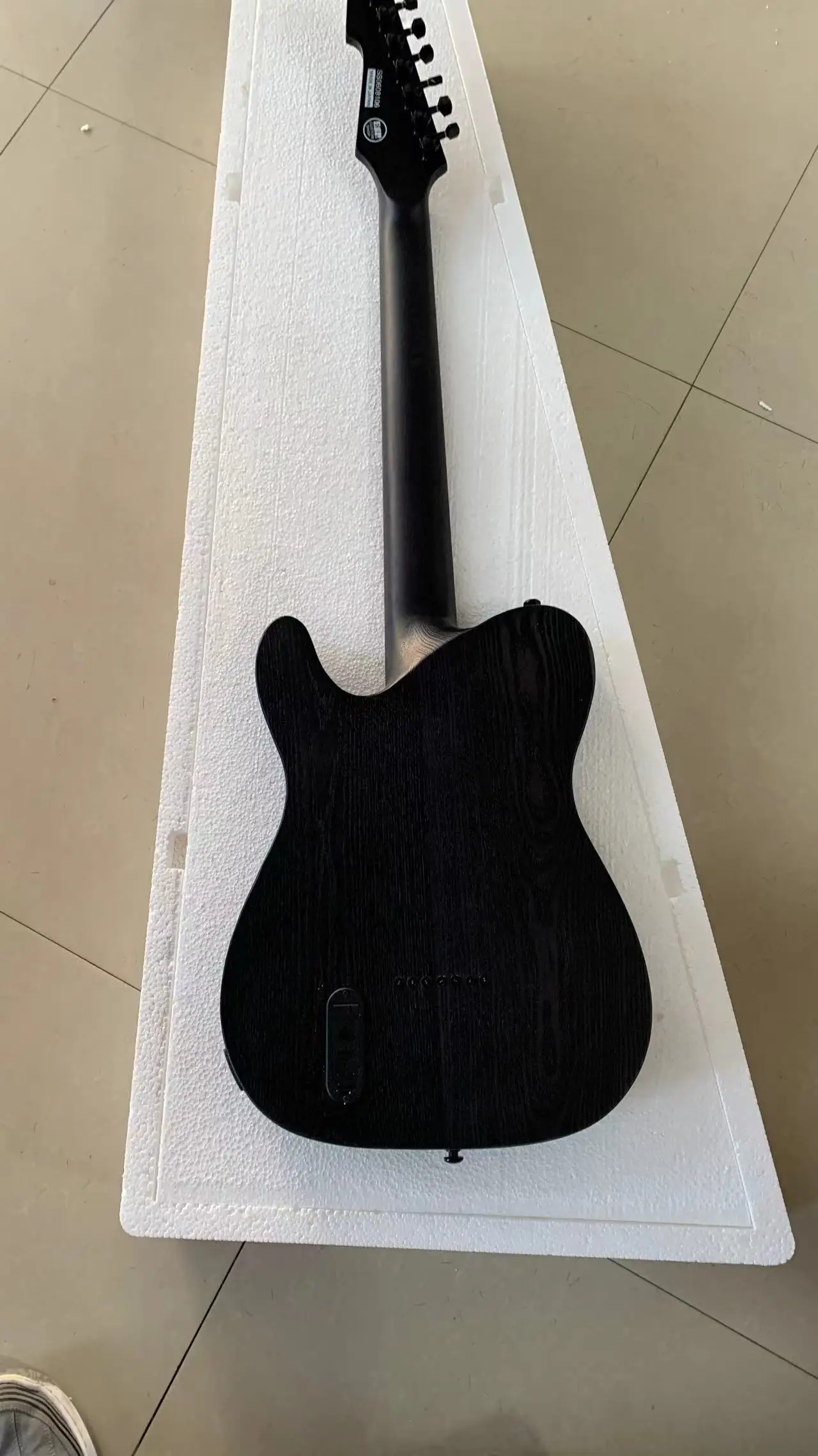 High-end custom 7-string oblique electric guitar, classic shape, transparent black ash body, active pickup, free delivery