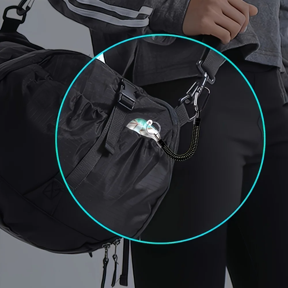 1 black spring coil keychain, equipped with a retractable wristband, with a length of 8.46 