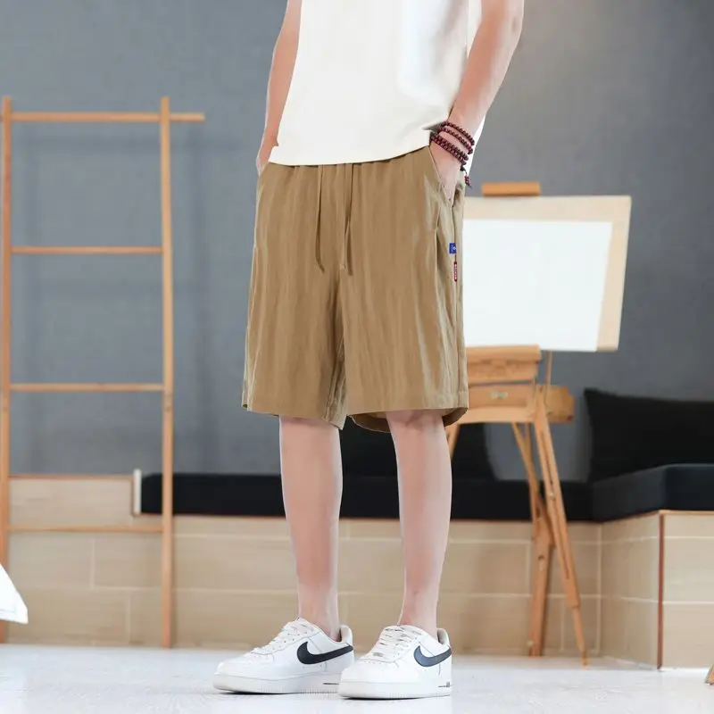 

Men's breathable linen casual shorts with elastic waistband and pockets, suitable for daily wear and outdoor activities