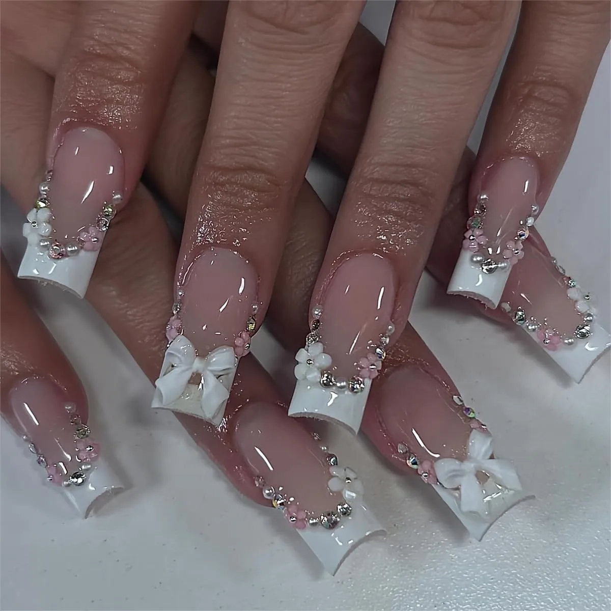 

24Pcs Medium Square Press on Nails White French Tip with 3D Bow Flower Rhinestone Pearl Design Full Cover Glossy Glue on Nails