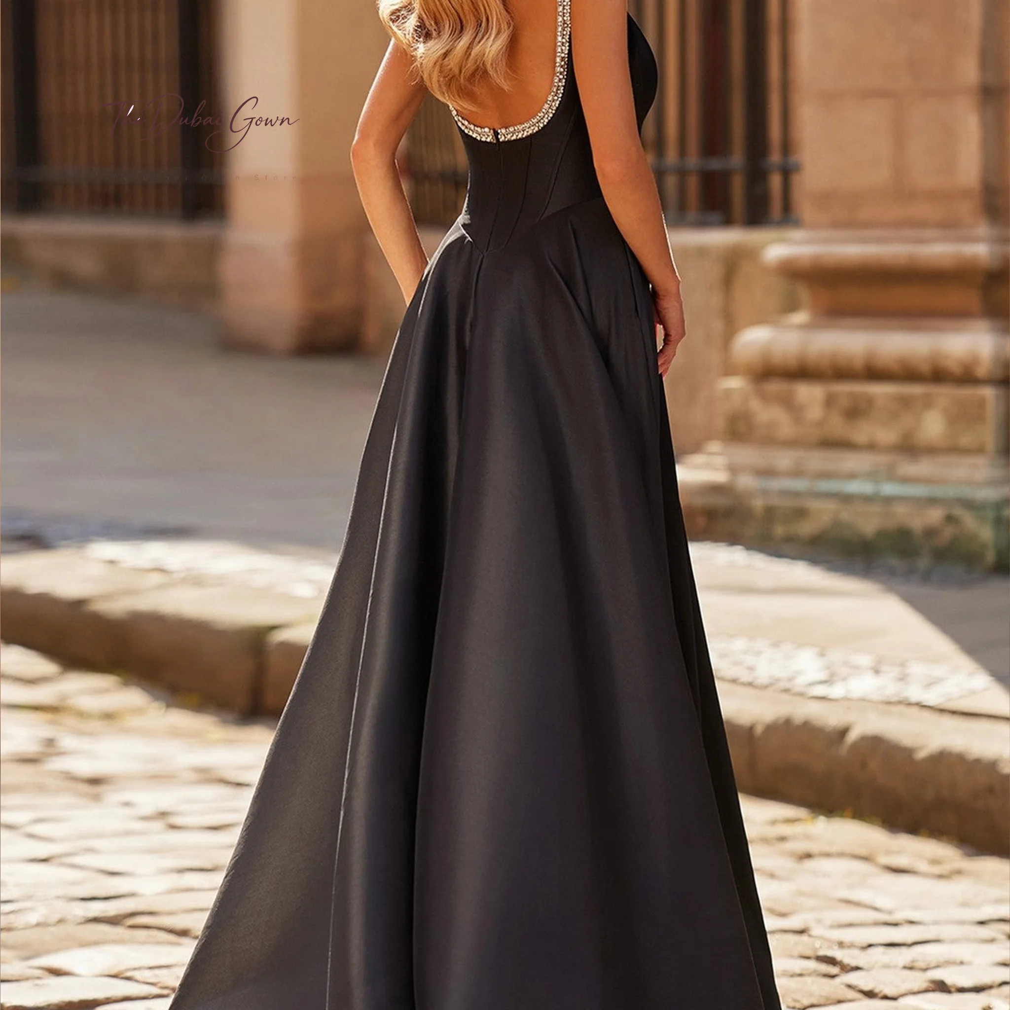 Black strapless sleeveless ball gown floor-length formal occasion/prom dress with beaded back fishtail corset and slit skirt