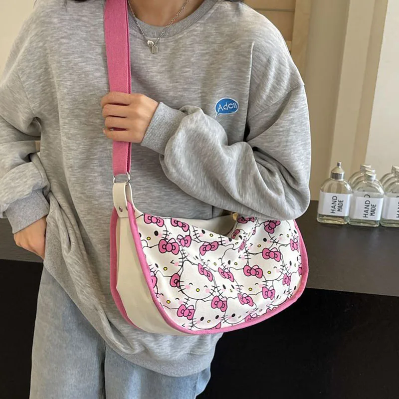 2024 New Sanrio Hello Kittys borsa di tela simpatico cartone animato stampa a schermo intero ragazza cuore Casual Versatile borsa a tracolla giocattoli regali per ragazza