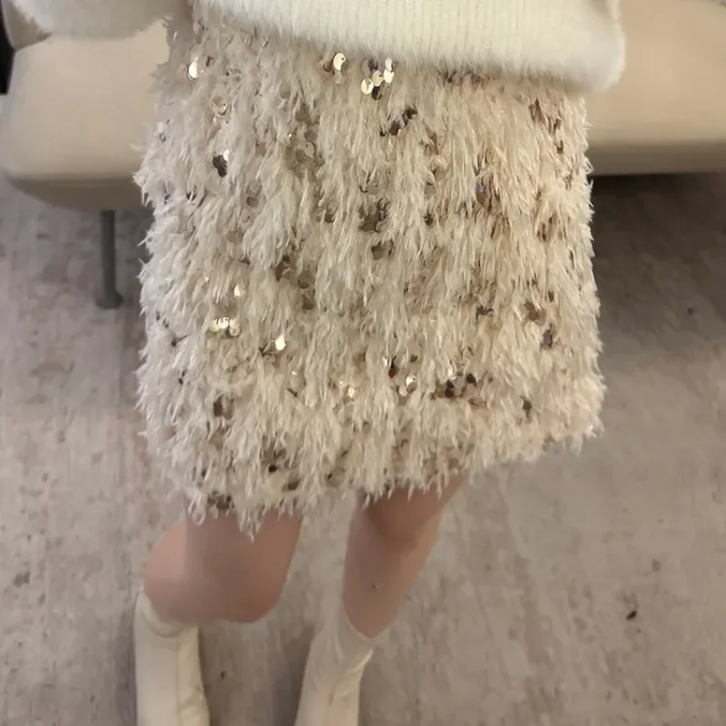 

Осенне-зимняя новая нежная абрикосовая короткая юбка с блестками и перьями, женская дизайнерская темпераментная легкая роскошная полуюбка
