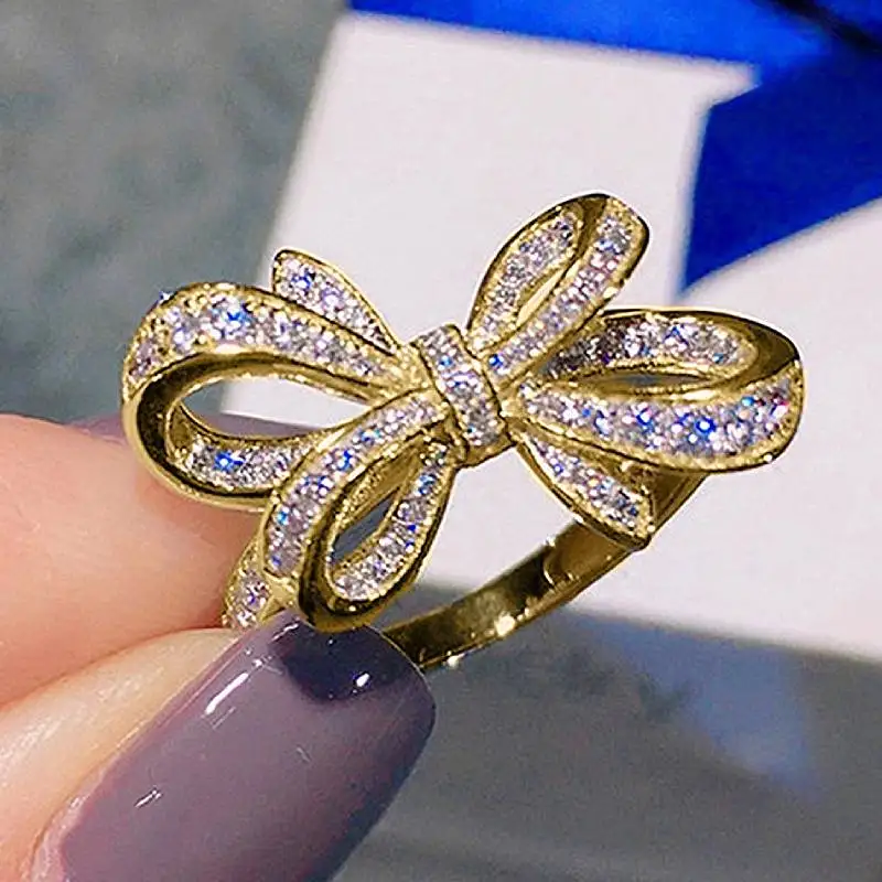 Huitan Bogenförmiger Damenring in Goldfarbe/Silberfarbe, modisch, für Partys, Verlobungen, elegantes Zubehör, ästhetischer Damenschmuck mit CZ