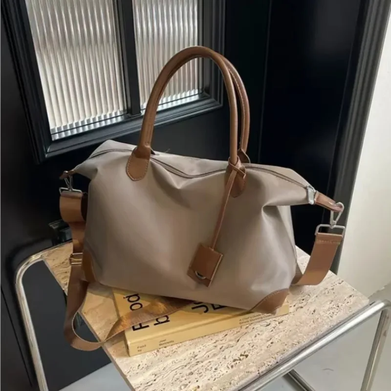 

Casual Concise Large Capacity Solid Color Oxford Spinning Travel Bag 2025 New Versatile Shoulder Bag Commuter Crossbody Bag