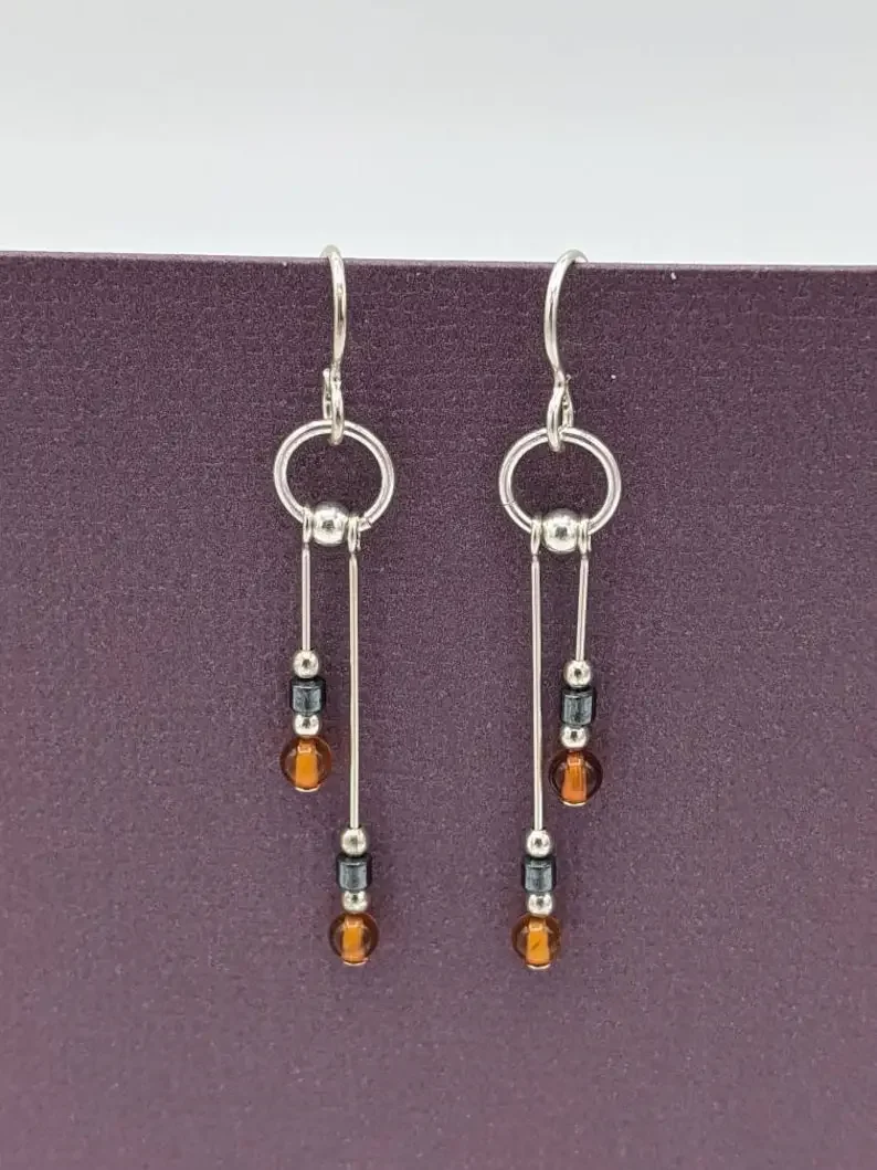 Amber earrings, asymmetric pendant earrings, real amber and hematite earrings