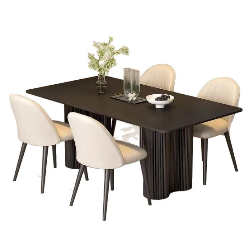 

Black rock slab dining table Italian new high-end modern simple dining table and chairs household small apartment rectangular