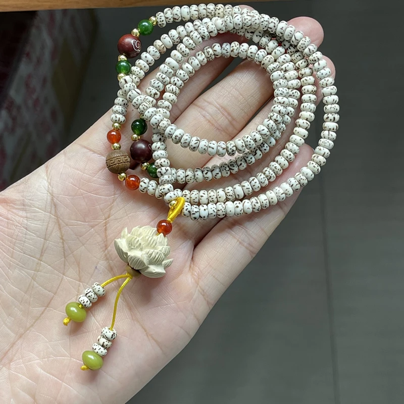 Star Moon Bodhi Seed Four-Ring Necklace, and Bracelet Combo, paired with a Boxwood Lotus