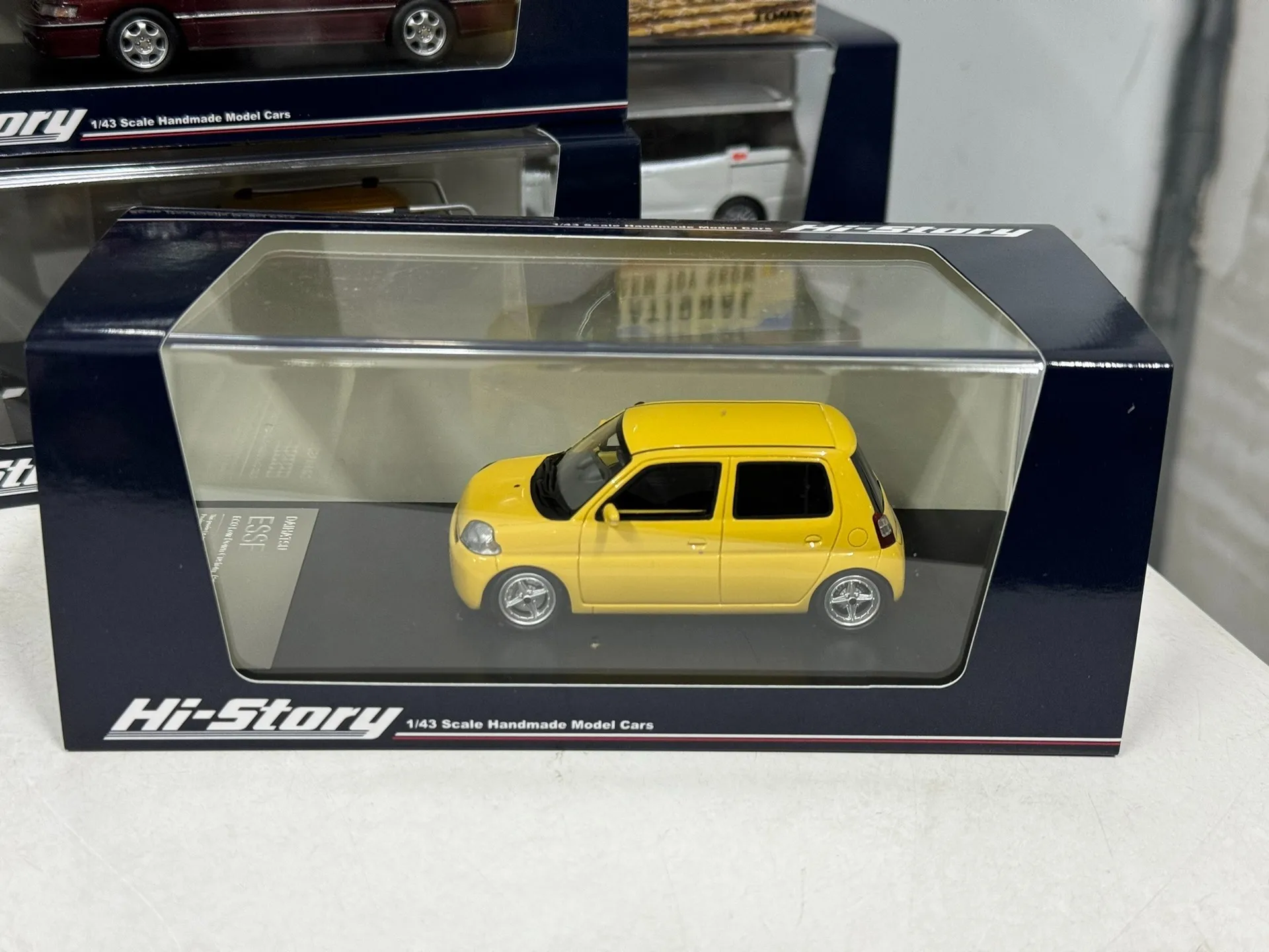 

Diecast HI Story 1/43 Scale Daihatsu Esse Light Yellow Resin Car Model Collectible Toy Gift Souvenir Display Ornament