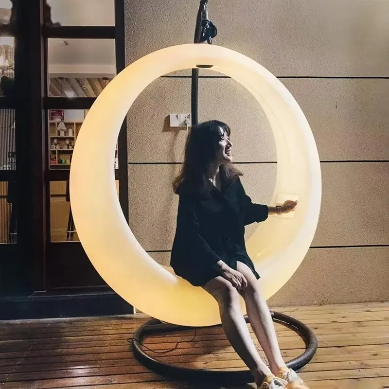 Moon-shaped patio swing for outdoor garden decoration with solar-powered crescent chair