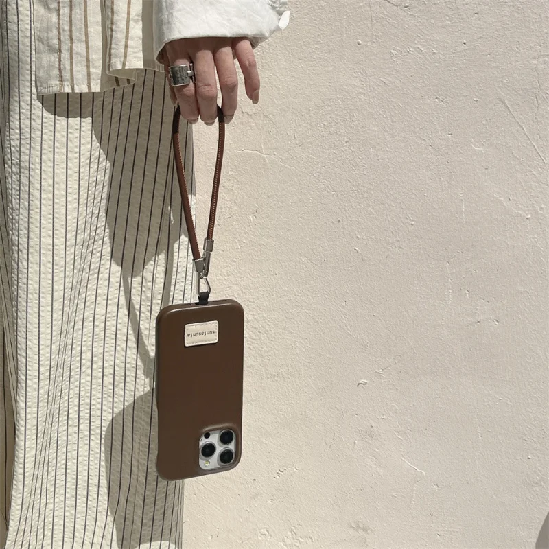 เคสโทรศัพท์หนังแท้สีพื้นแบบมีเท็กซ์เจอร์ระดับไฮเอนด์ ใช้ได้กับ Apple 16/15/14P เรียบง่ายและมินิมอล iPhone 13/12