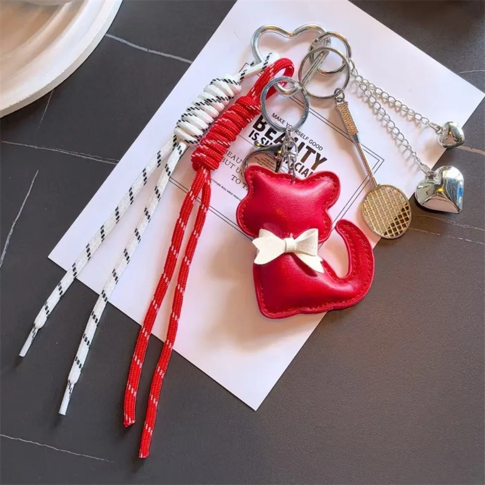 

Кожаный брелок с изображением кота, легкая подвеска-рюкзак с кисточкой и сердечком, многофункциональная подвеска-ракетка для бадминтона, подарочные аксессуары