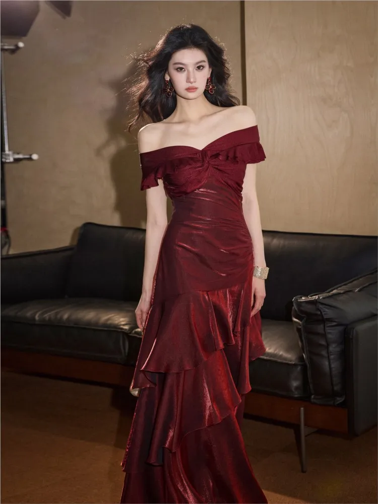 

A red one-shoulder cinched waist elegant and light luxury dress