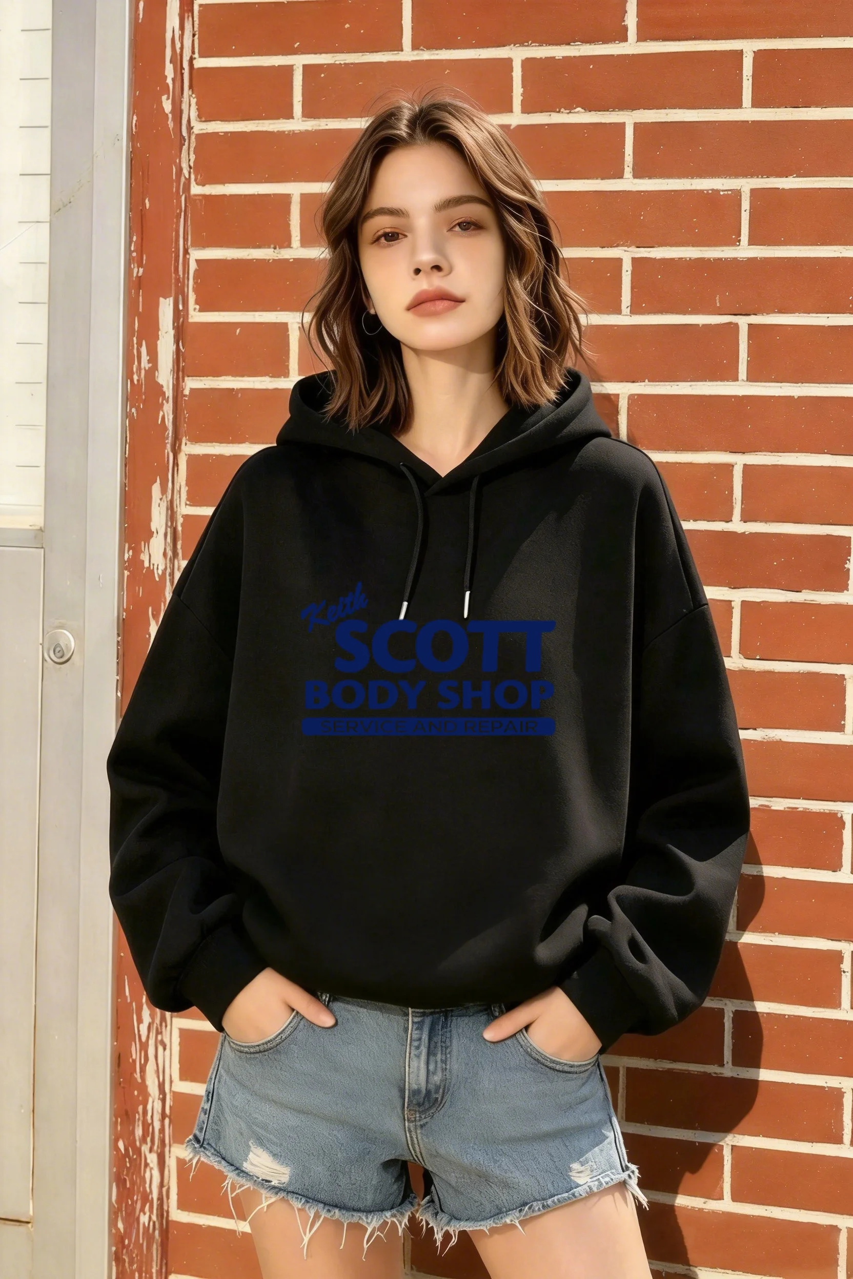 

Women's Black Oversized Hoodie with blue "Keith SCOTT BODY SHOP" letter print, casual & trendy for fall and winter daily wear.