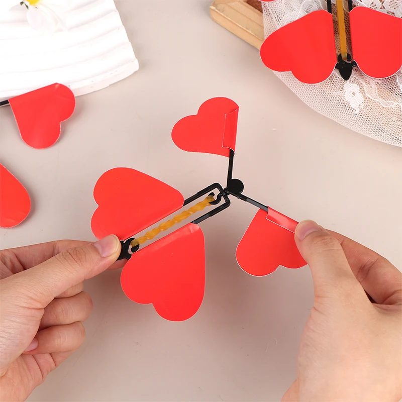 5/10/12 Uds. Juguete mágico de mariposa voladora, juguetes mágicos novedosos, banda de goma alimentada, trucos de magia de cuerda, juguetes, recuerdo de fiesta