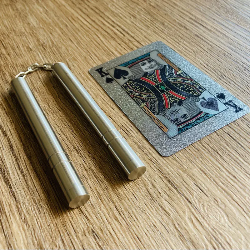 

Mini EDC bolso dedo nunchaku descompressão brinquedo, ao ar livre multifuncional ferramentas anti-stress, aço inoxidável