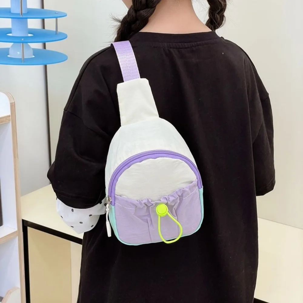 กระเป๋าคาดอกเด็กแฟชั่น ไนลอน ตัดเย็บสีสันสวยงาม น้ำหนักเบา สะพายข้างได้ ใช้เป็นกระเป๋าใส่เหรียญได้ เหมาะสำหรับกิจกรรมกลางแจ้ง