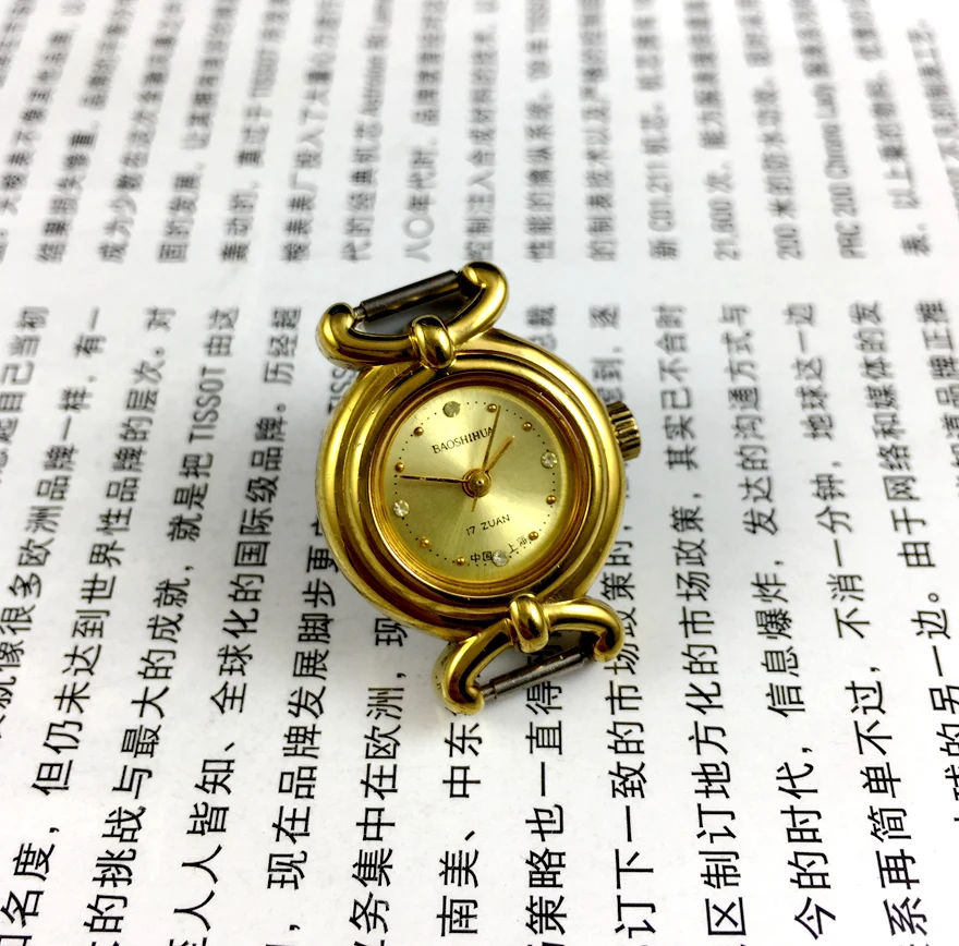 

Shanghai Gem Flower brand yellow literal manual mechanical women's watch, 22mm diameter, free belt.