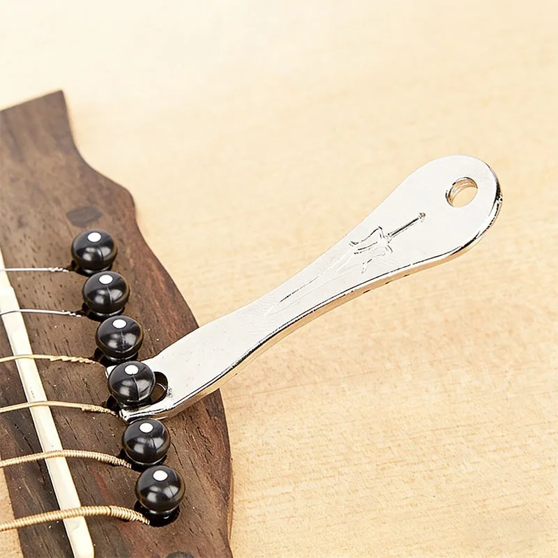 

Metal Guitar String Puller Wooden Folk Pry Up String Guitar String Tool Metal Guitar Nail Puller Portable and Lightweight