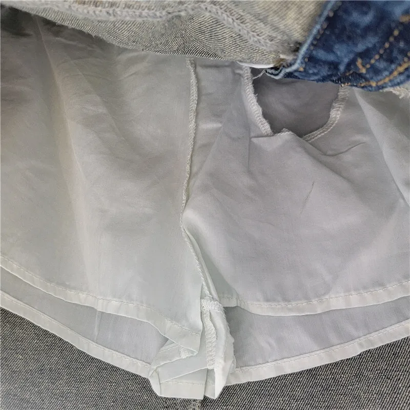 WTHT, nueva moda, faldas vaqueras a rayas lavadas para mujer, moda de verano 2025, falda acampanada de cintura alta con una hilera de botones para mujer 1LS2018