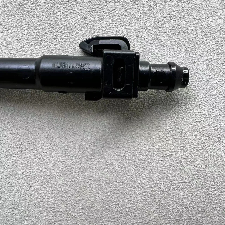 High Pressure Cleaning of Beige Tiled Wall: Stream of Water from Nozzle High Pressure Cleaning of Beige Tiled Wall: Stream of Water from Nozzle