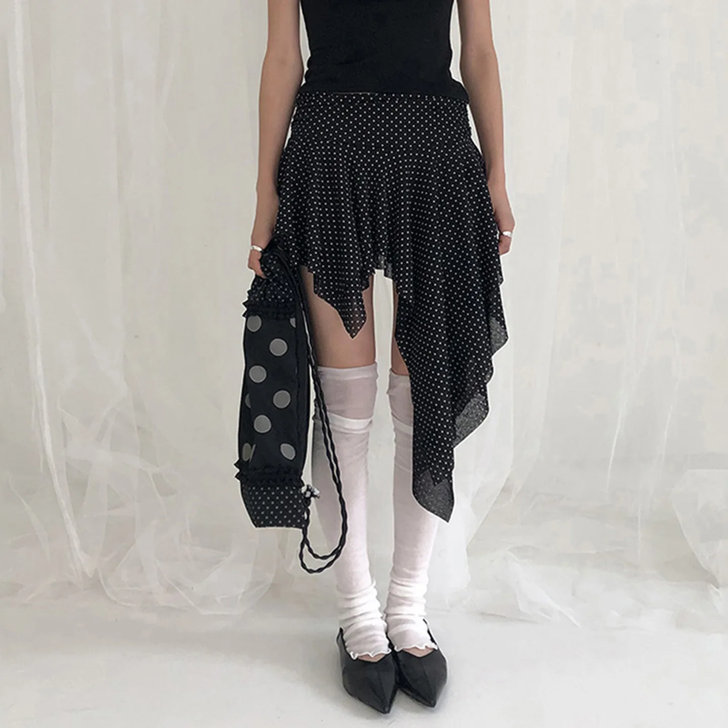Europe and the United States dark polka-dot printed low-waisted skirt sexy slim mesh stitching irregular skirt in summer.