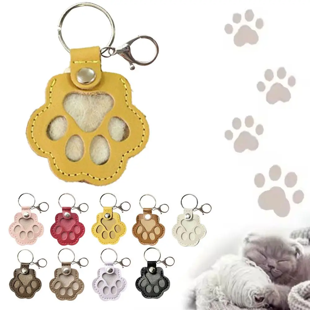 สัตว์เลี้ยงผมเก็บพวงกุญแจหนังสัตว์เลี้ยงผมพวงกุญแจน่ารัก Cat PAW Design Creative PET Hair Storage แคปซูลแบบพกพาอุปกรณ์เสริม