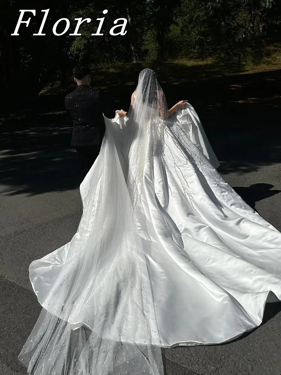 ชุดแต่งงานแบบมีลูกปัดมุกหรูหราสั่งทำพิเศษ แขนยาว พร้อมกระโปรงแบบถอดได้