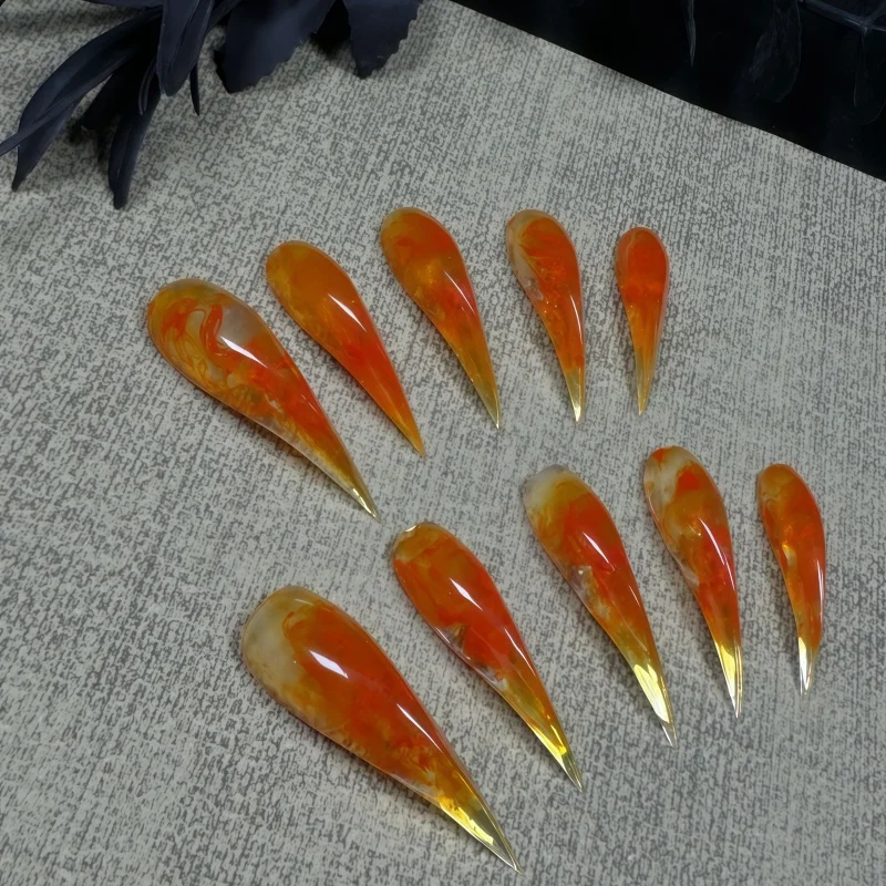 10PCS of semi-transparent gel orange and amber vortex-shaped fake nails, with smoky gradient long-pointed fake nails