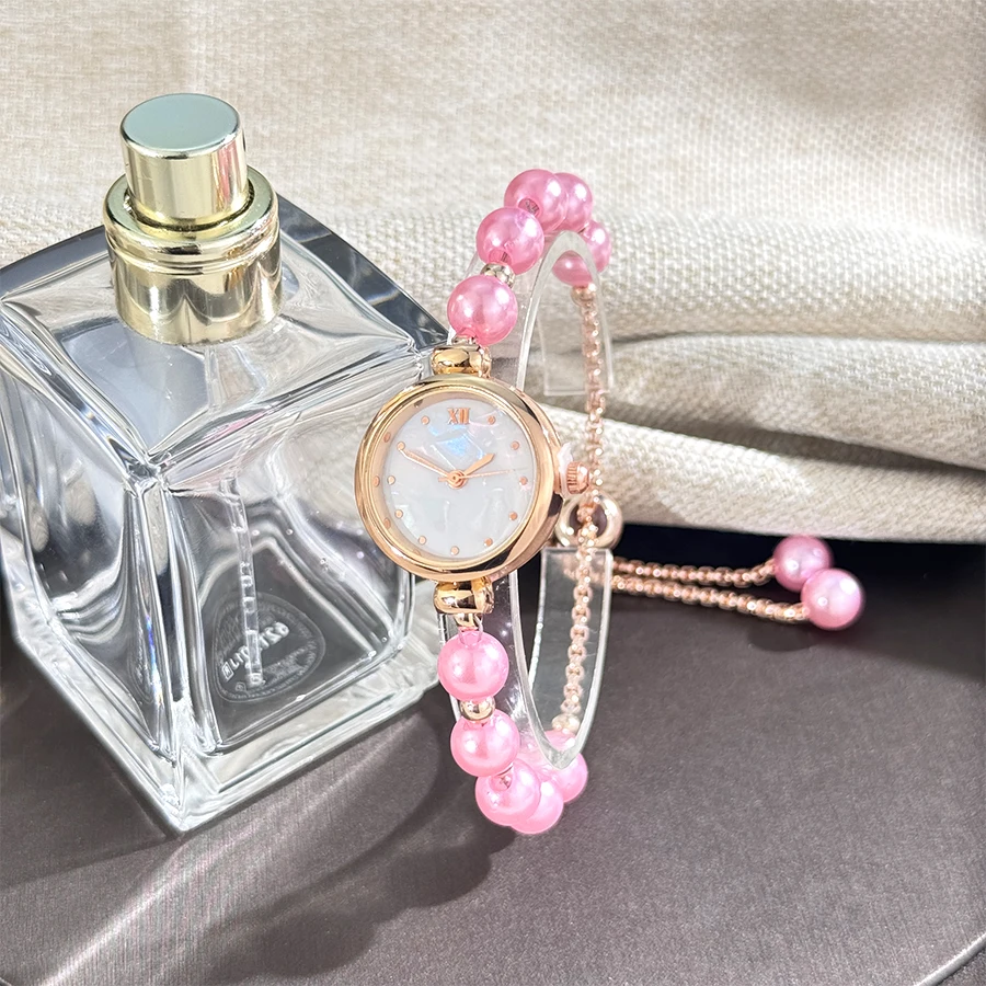 الفرنسية رومانسية اللؤلؤ سحب الحبل ساعة محمولة أنيقة صغيرة موضة سوار كوارتز ساعة اليد ساعة محمولة أنيقة