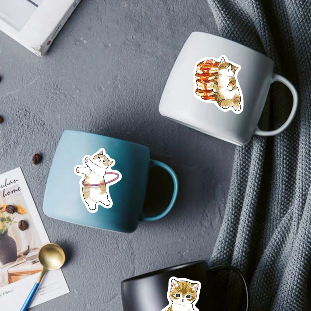 64 قطعة من ملصقات القط الأصفر الكرتونية اللطيفة للأمتعة المكتبية للهاتف والقهوة والدراجات النارية والقرطاسية والشارات الأكثر مبيعًا في أمازون ﻿