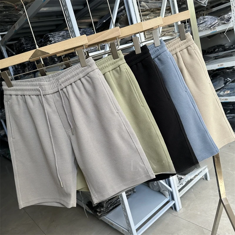 

Men's Spor Pure Color Breathable Loose Fit Elastic Waist ort orts Five-Quarter Length Casual Pants Summer 2024