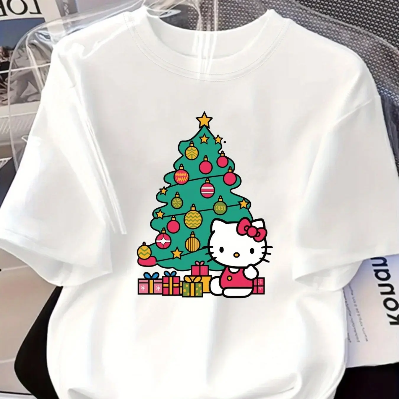 

Sanrio Hello Kitty Short Sleeved T-shirt - Round Neck Top with Christmas Tree Print, Pink Bow and Gift - Cute Casual