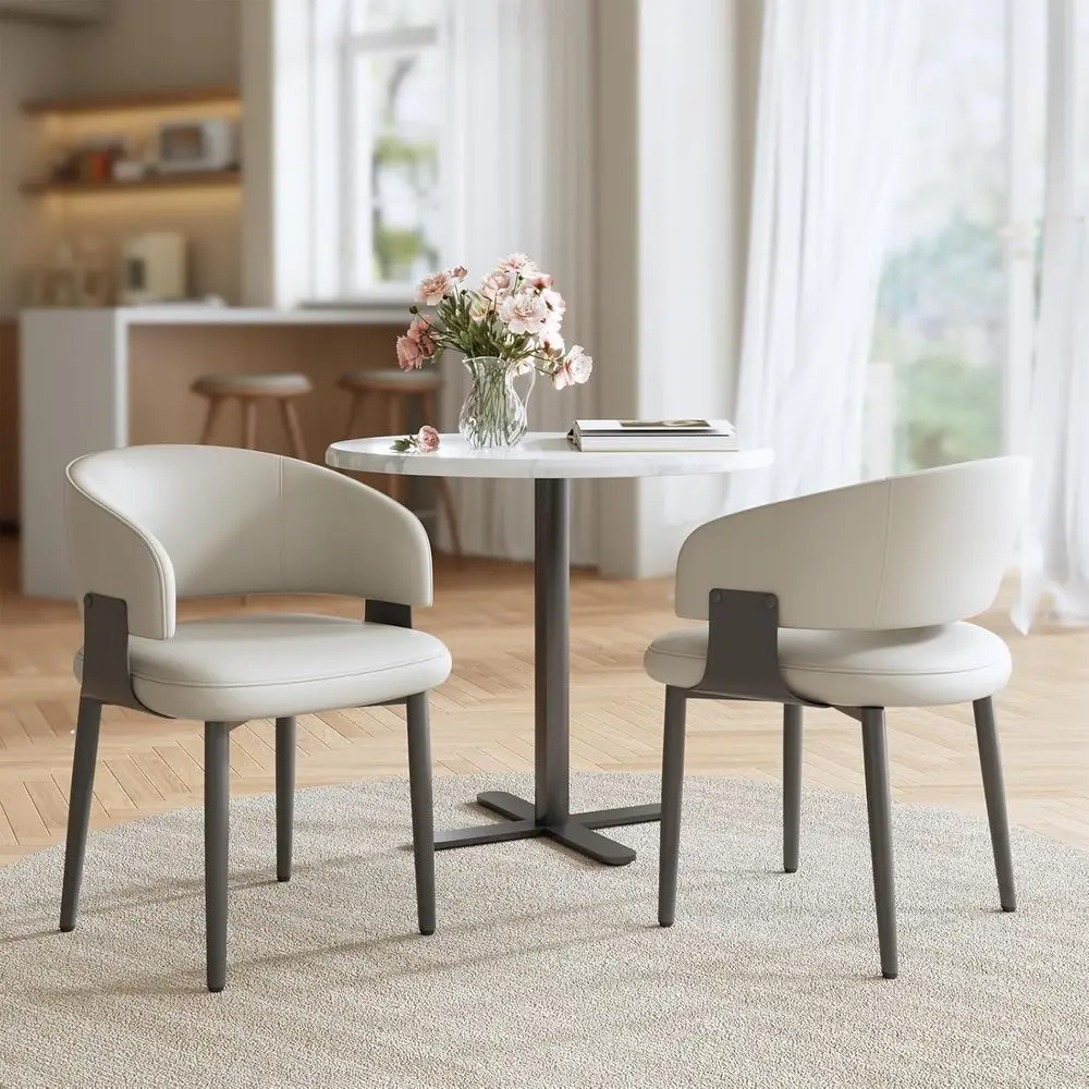 

Pair of Modern Faux Leather Dining Chairs with Curved Backrest and Metal Legs, Suitable for Kitchen, Dining Room, or Café in Lig