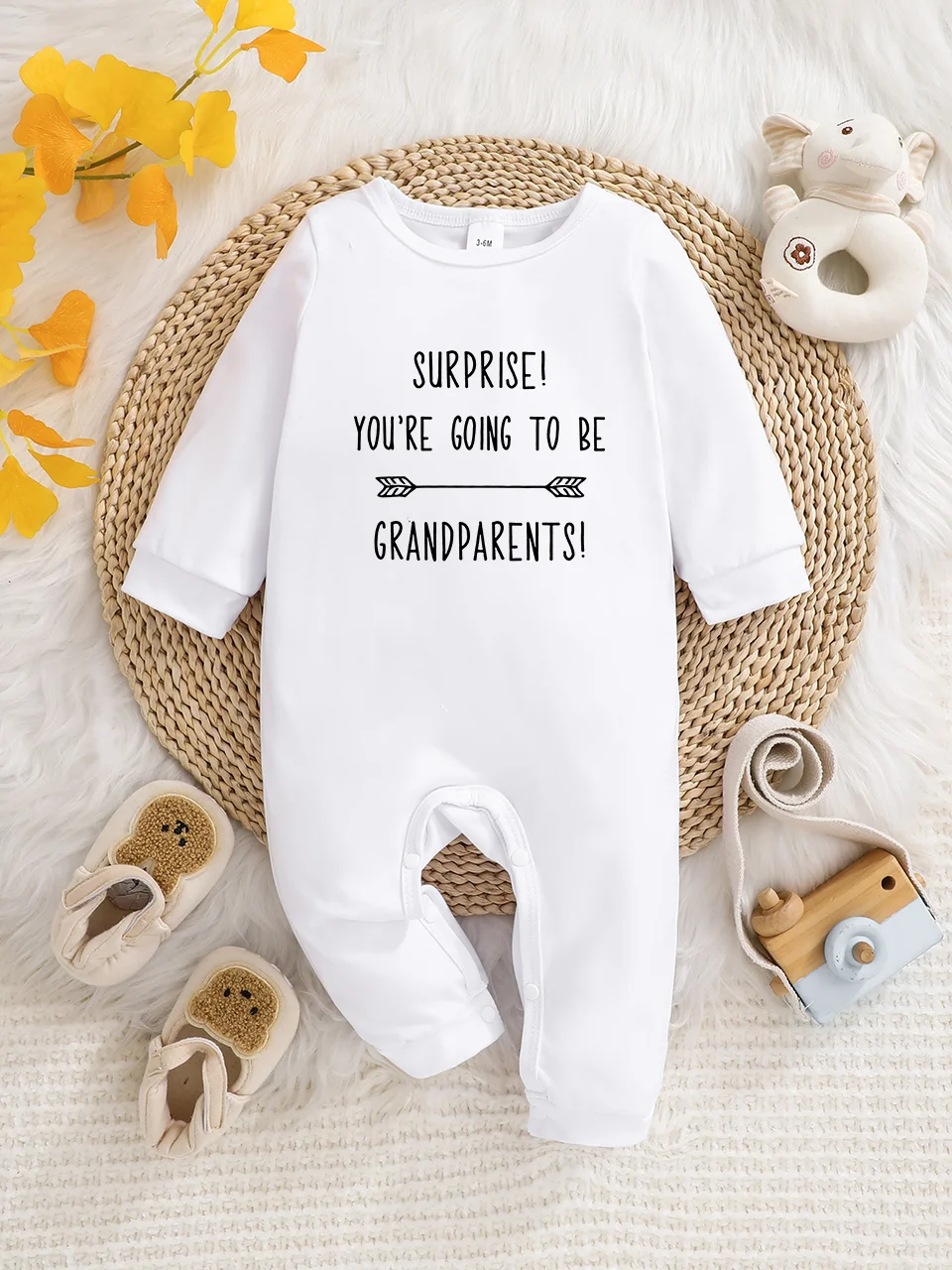 A baby long-sleeved onesie with interesting letter prints. It features a buttoned design for easy putting on and taking off