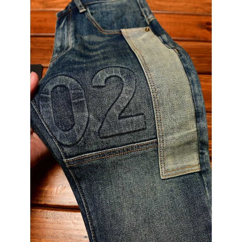

Модные элитные мужские джинсы, приталенный крой, маленькие ноги, стираный лоскутный дизайн в стиле ретро, модные и роскошные мужские брюки.