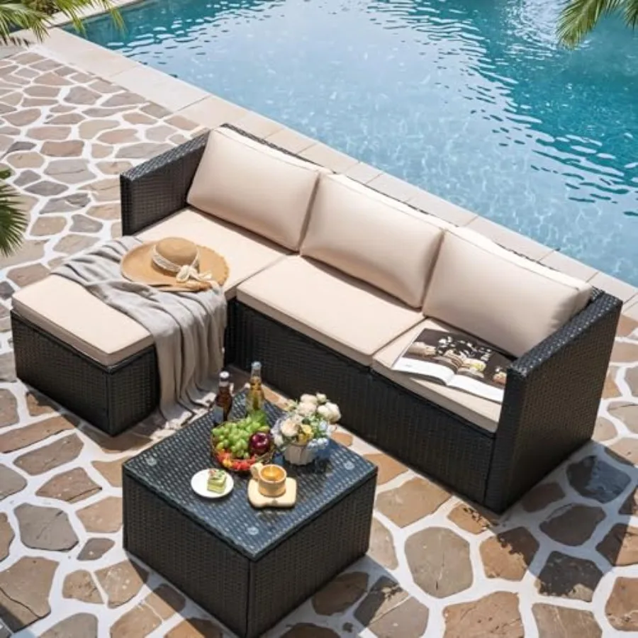 Outdoor patio furniture set: beige wicker rattan sectional sofa with adjustable seat and soft cushions, plus coffee table for y